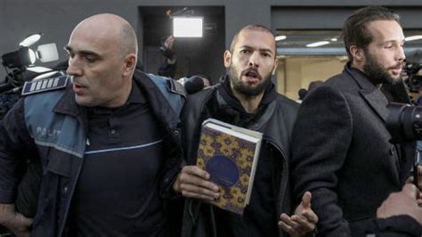 Jan 10, 2023 · Tate was handcuffed to his brother in the images, and carried a book Insider identified as a Quran. Photos show Andrew Tate arriving at Romanian court Tuesday, handcuffed to his brother Tristan and carrying the Quran. Tate, Tristan, and two Romanian women were photographed pulling up to the courthouse in a police van. 